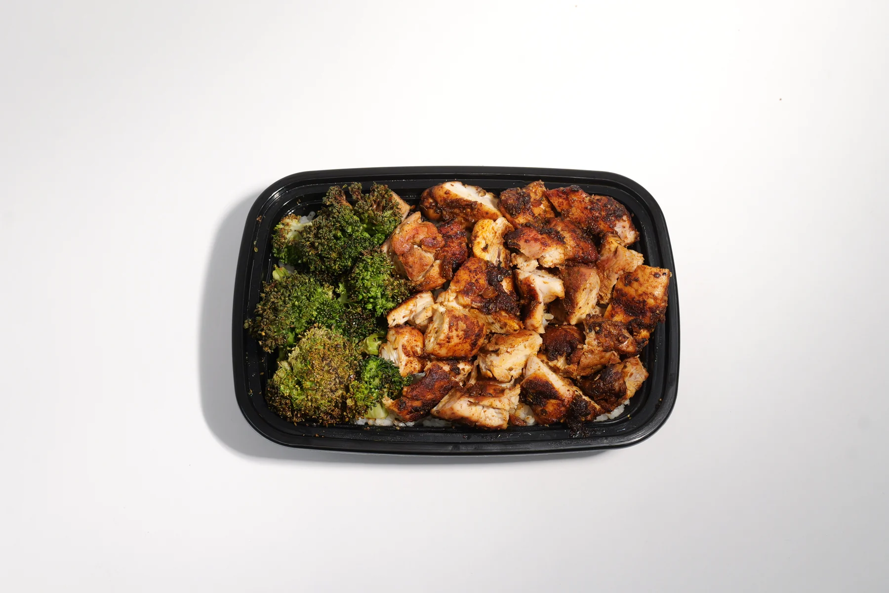 Big Chicken meal prep boxes with rice and broccoli