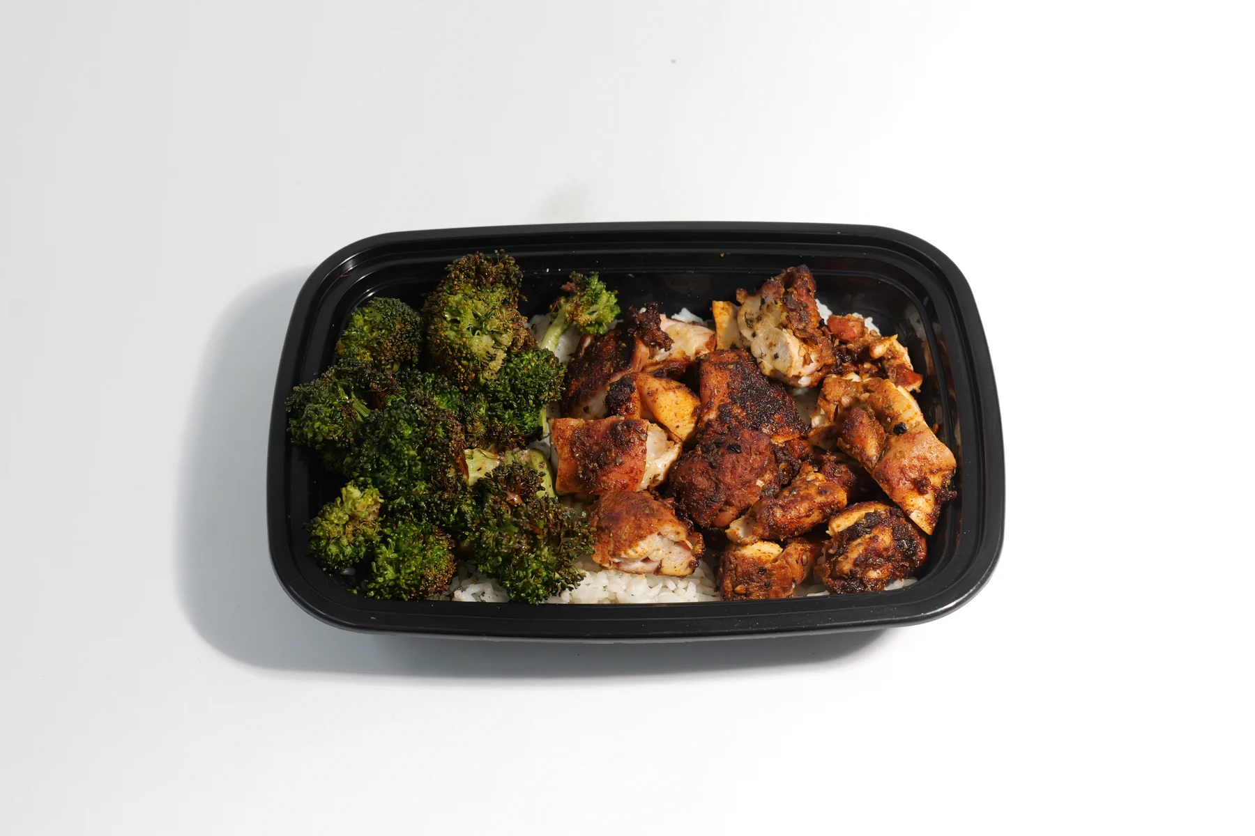 Little Chicken meal prep boxes with rice and broccoli